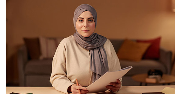 Human with printed hand out of papers