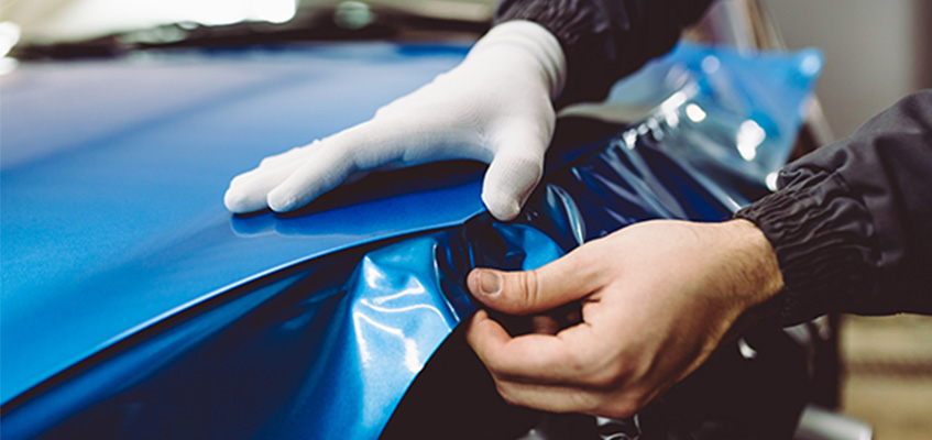 Car wrapping done by hand