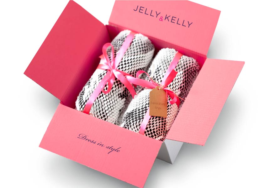 Branded packaging, with an opened lid, showing a product