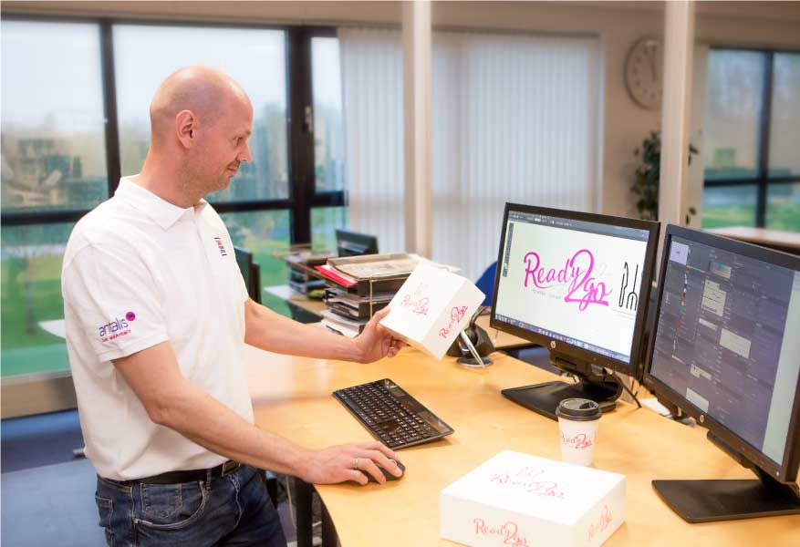Packaging designer creating a packaging model on its computer