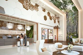 Hall de réception d'un hôtel décoré dans des teintes naturelles